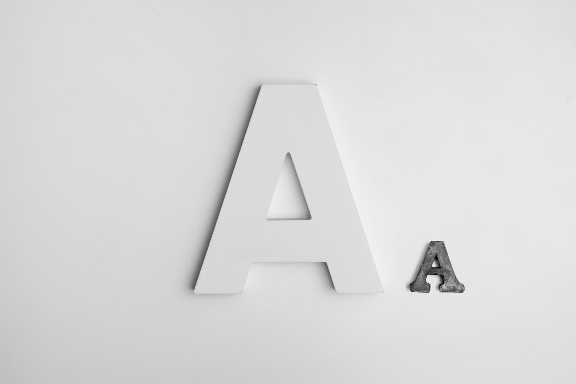 Two different sized letters