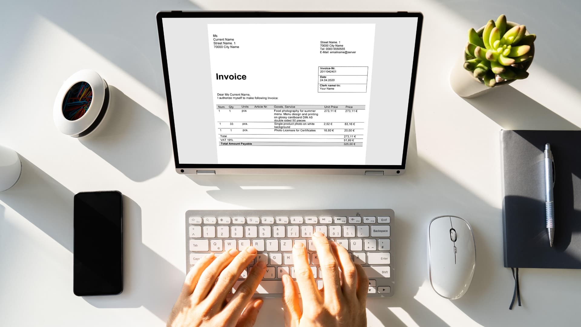 Person sending invoice via email on their computer