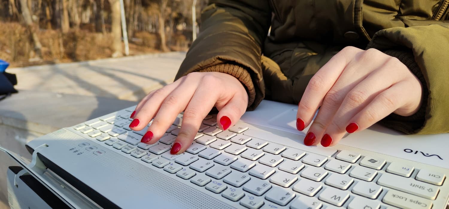 Woman starting a professional email on her laptop