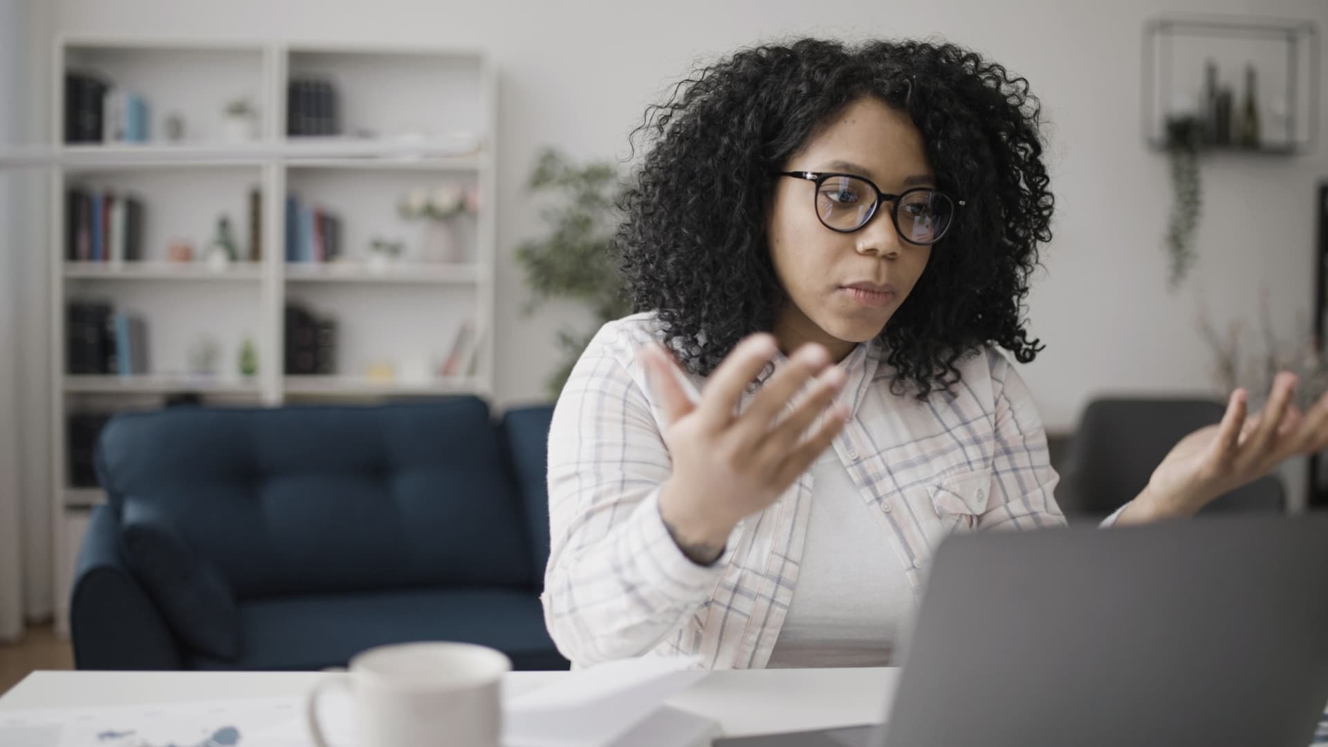 Woman at laptop unsending emails