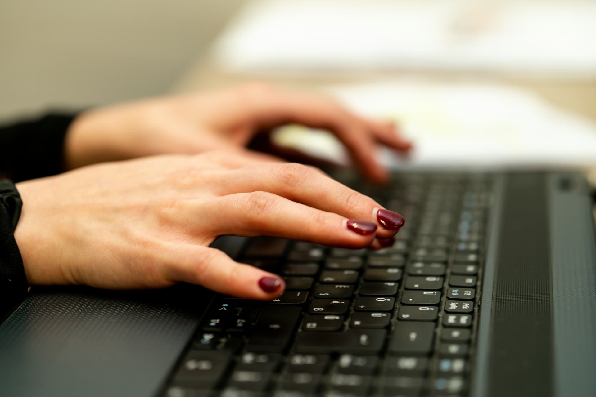 Woman writing introductory email on her laptop
