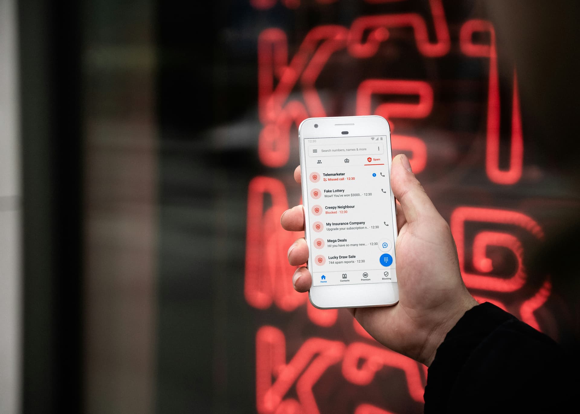 Person reading phone outfdoors