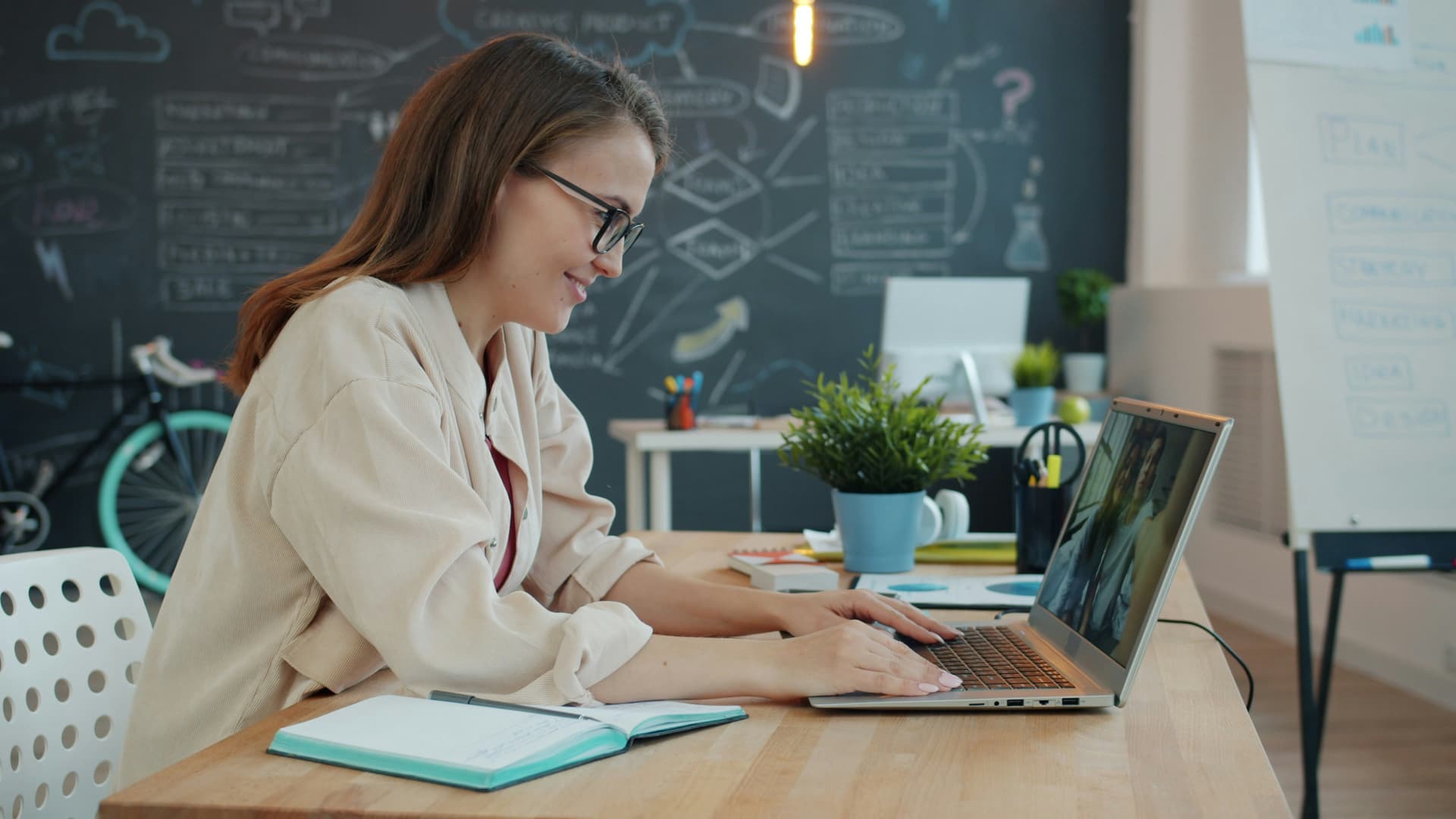 Woman looking at laptop screen