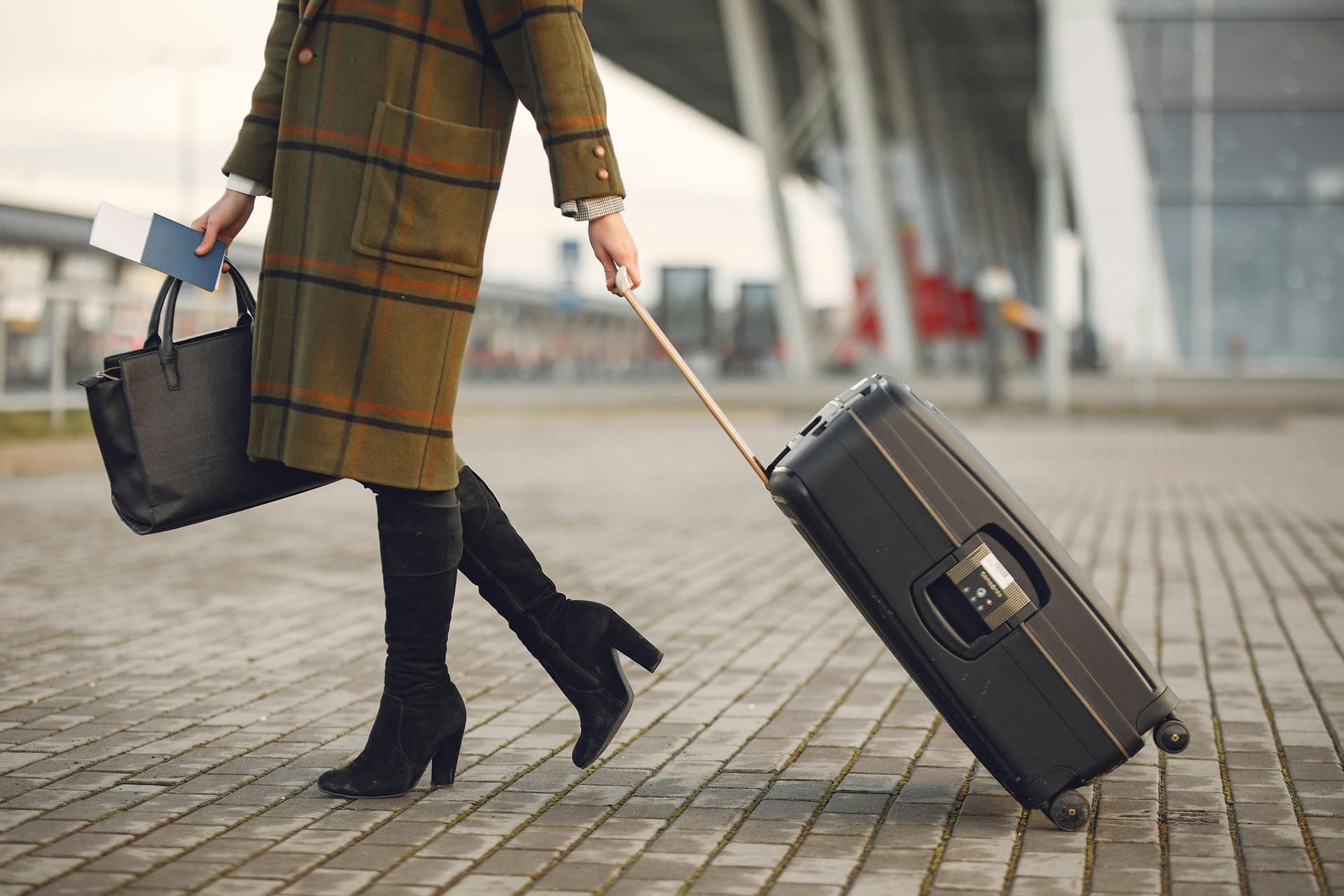Woman pulling suitcase