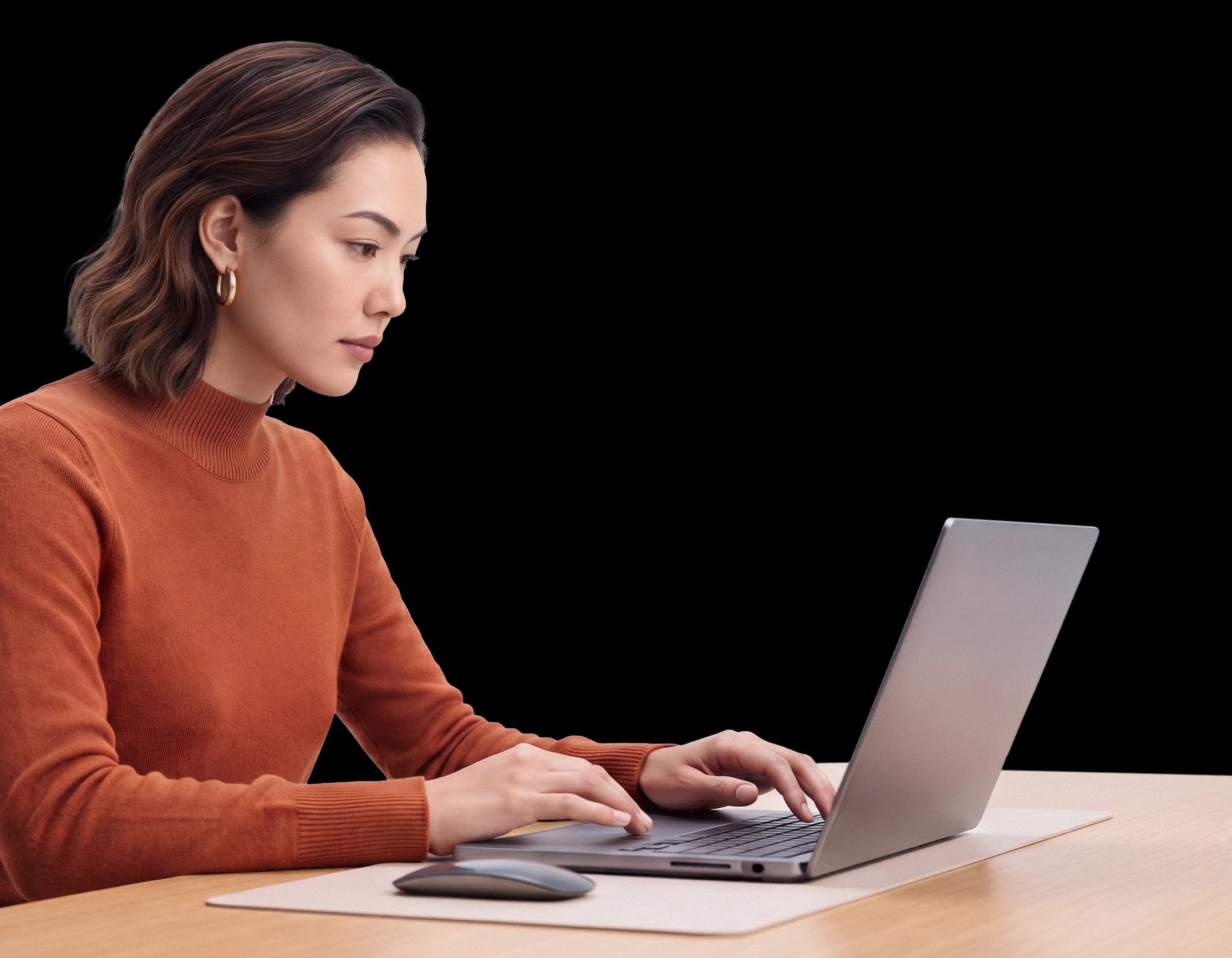 Amara working at her laptop