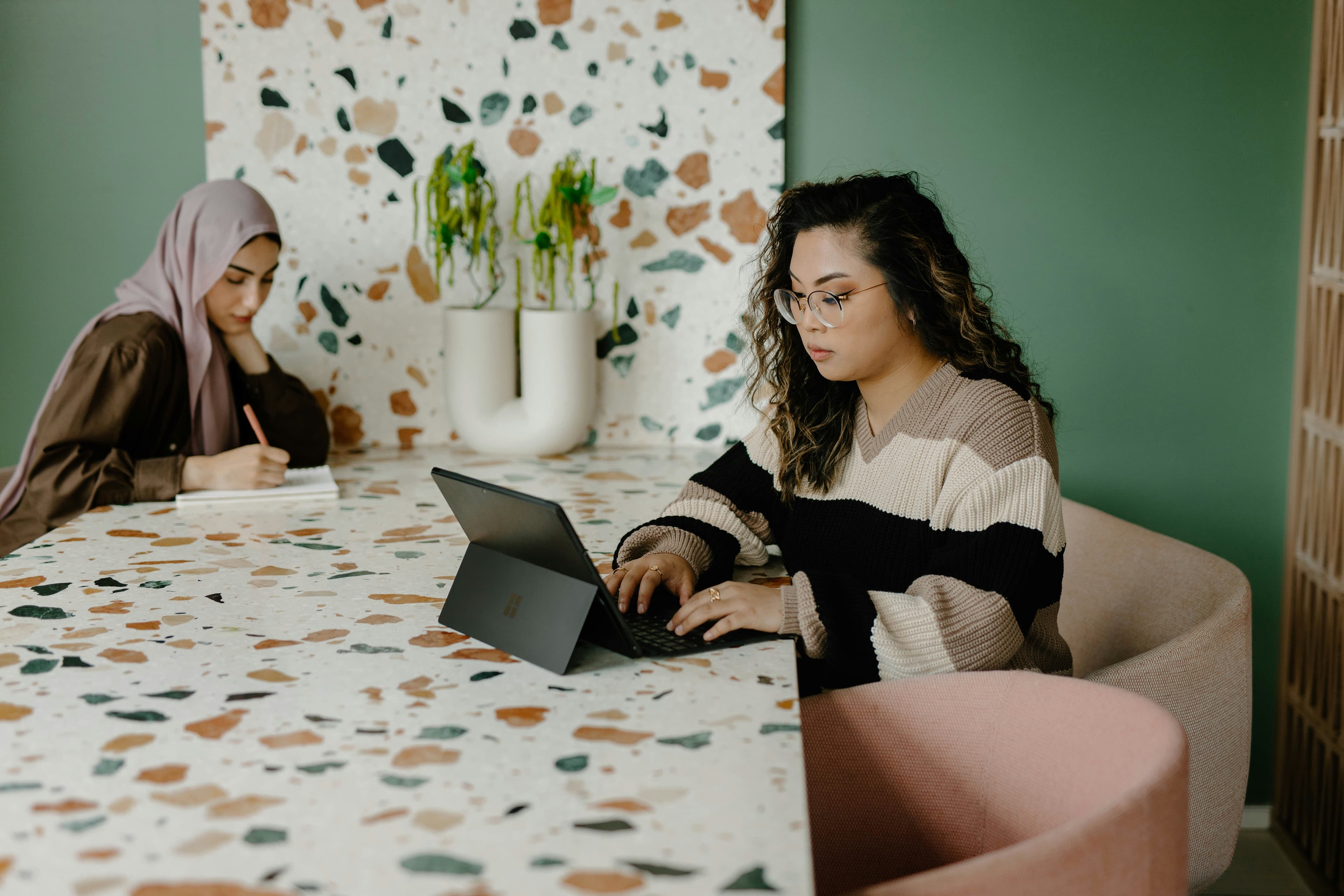Two women working at a desk