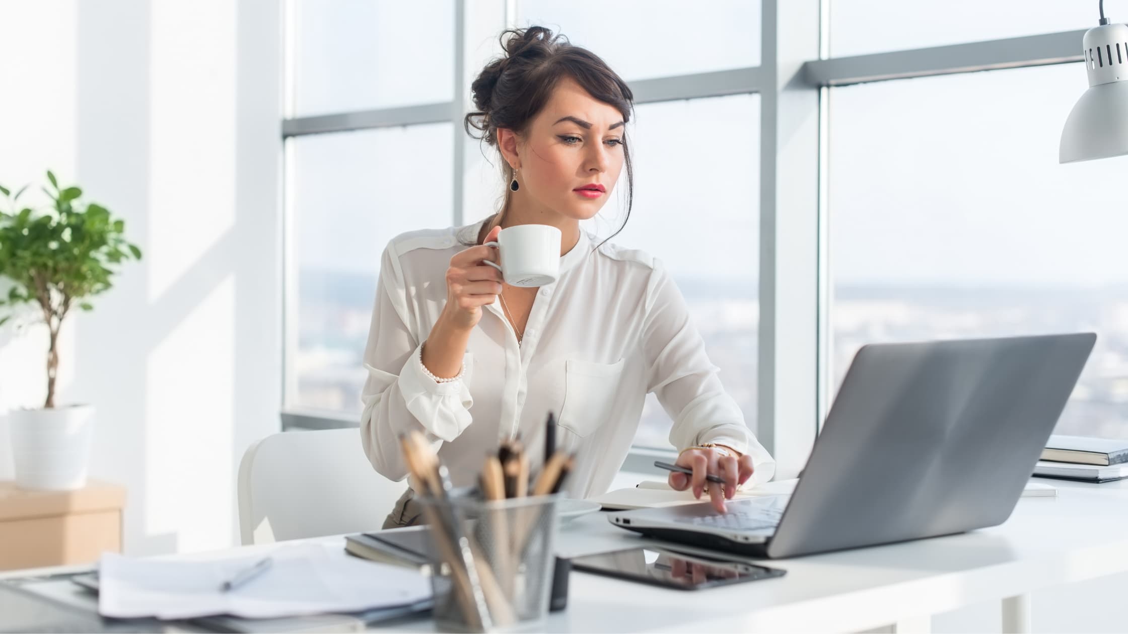 Woman at laptop, blocking emails