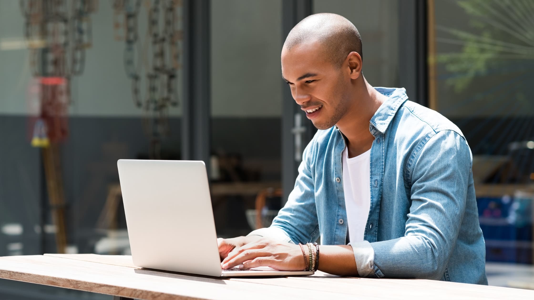 Man at laptop, changing his email address