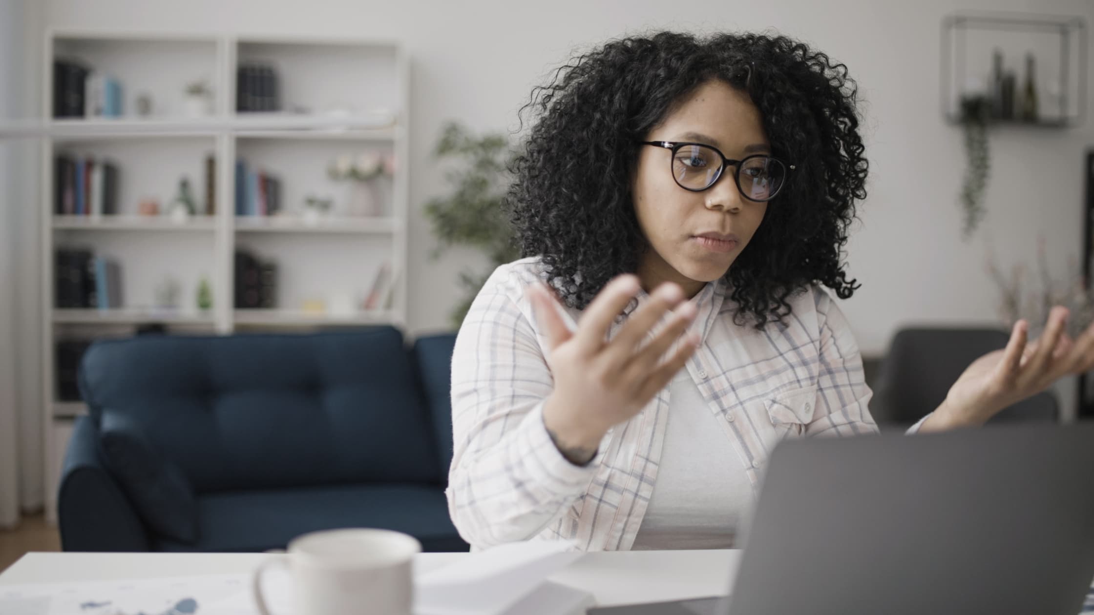 Woman at laptop unsending emails