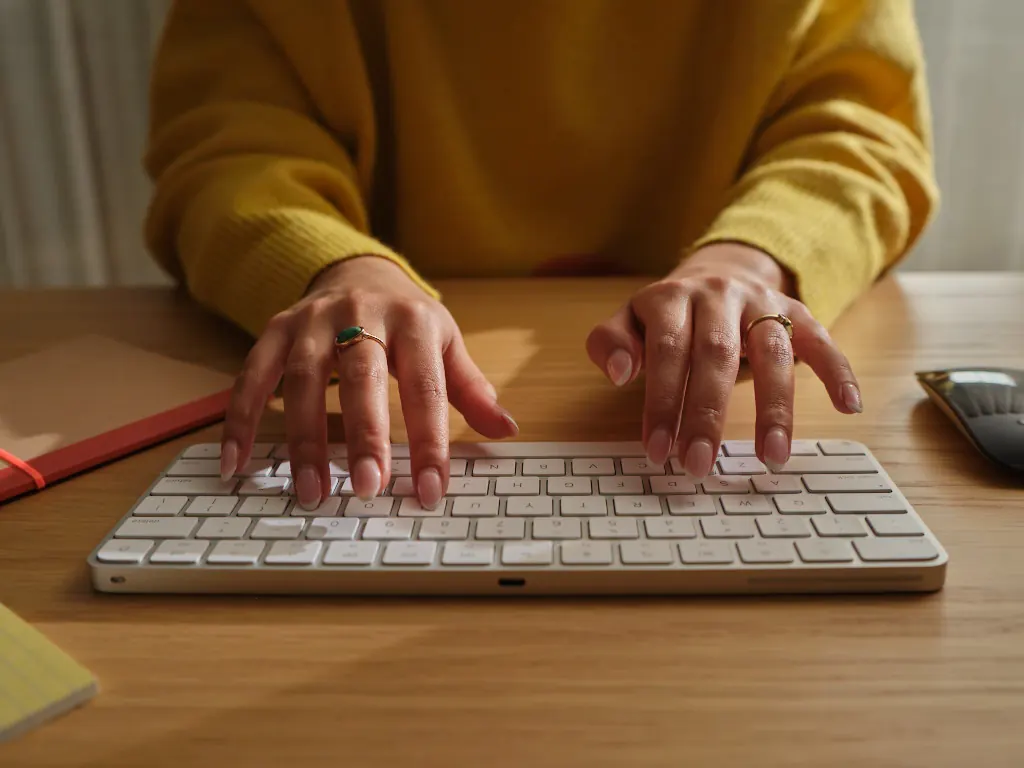 Person typing at keyboard