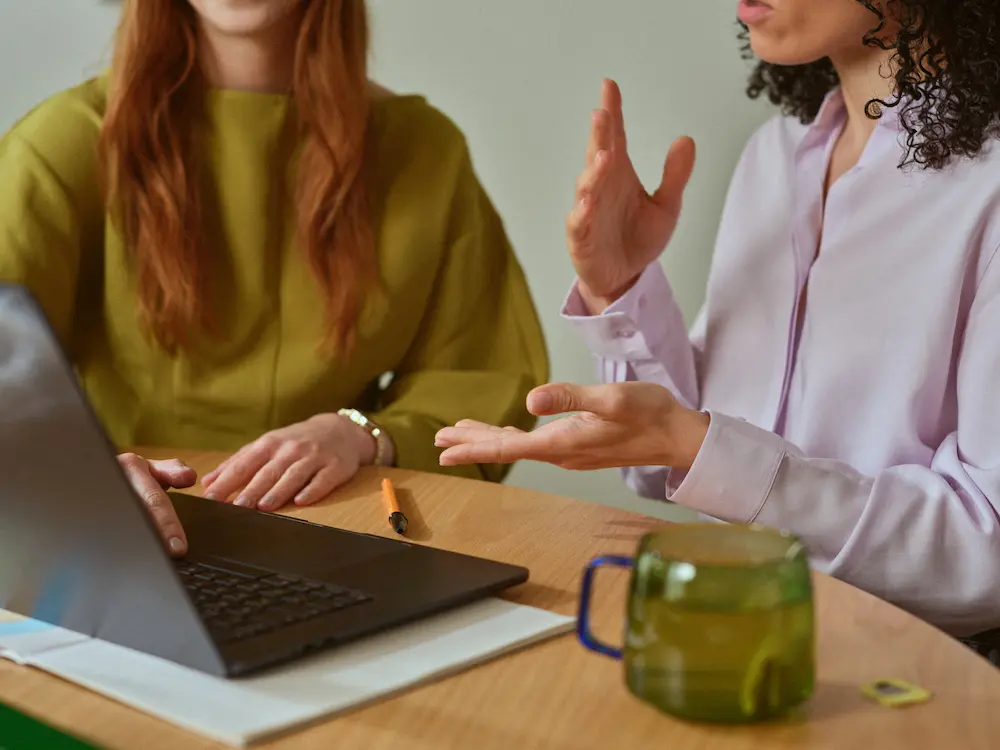 Team collaborating with AI email rewriting tools